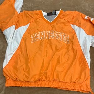 Orange and white Tennessee pullover light jacket.